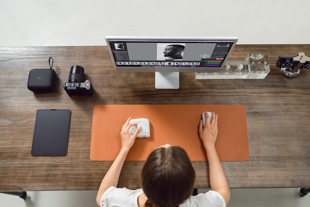 woman edits photos on a computer scratched dvd microfiber cloth cleaning table