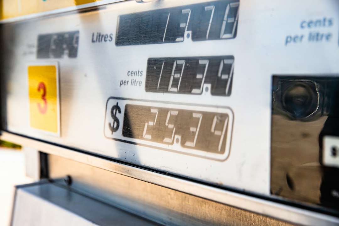 a close up of a digital clock price comparison gas prices savings math