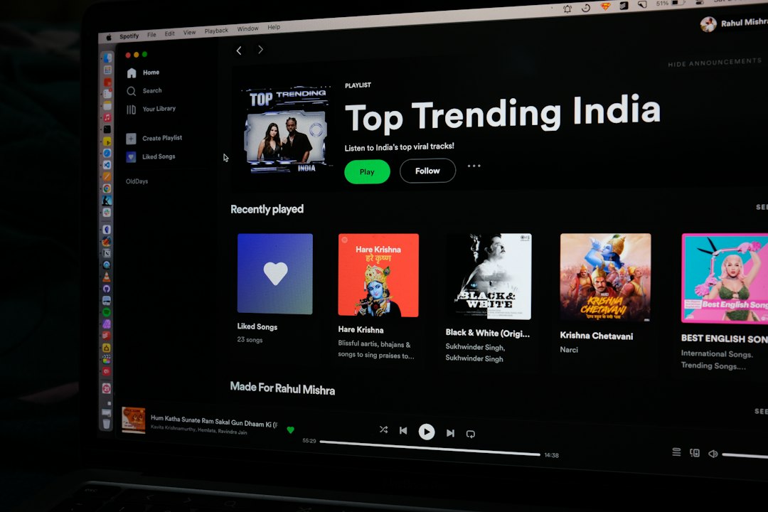 a computer screen with the top trending india logo on it colorful genre chart spotify playlist music discovery