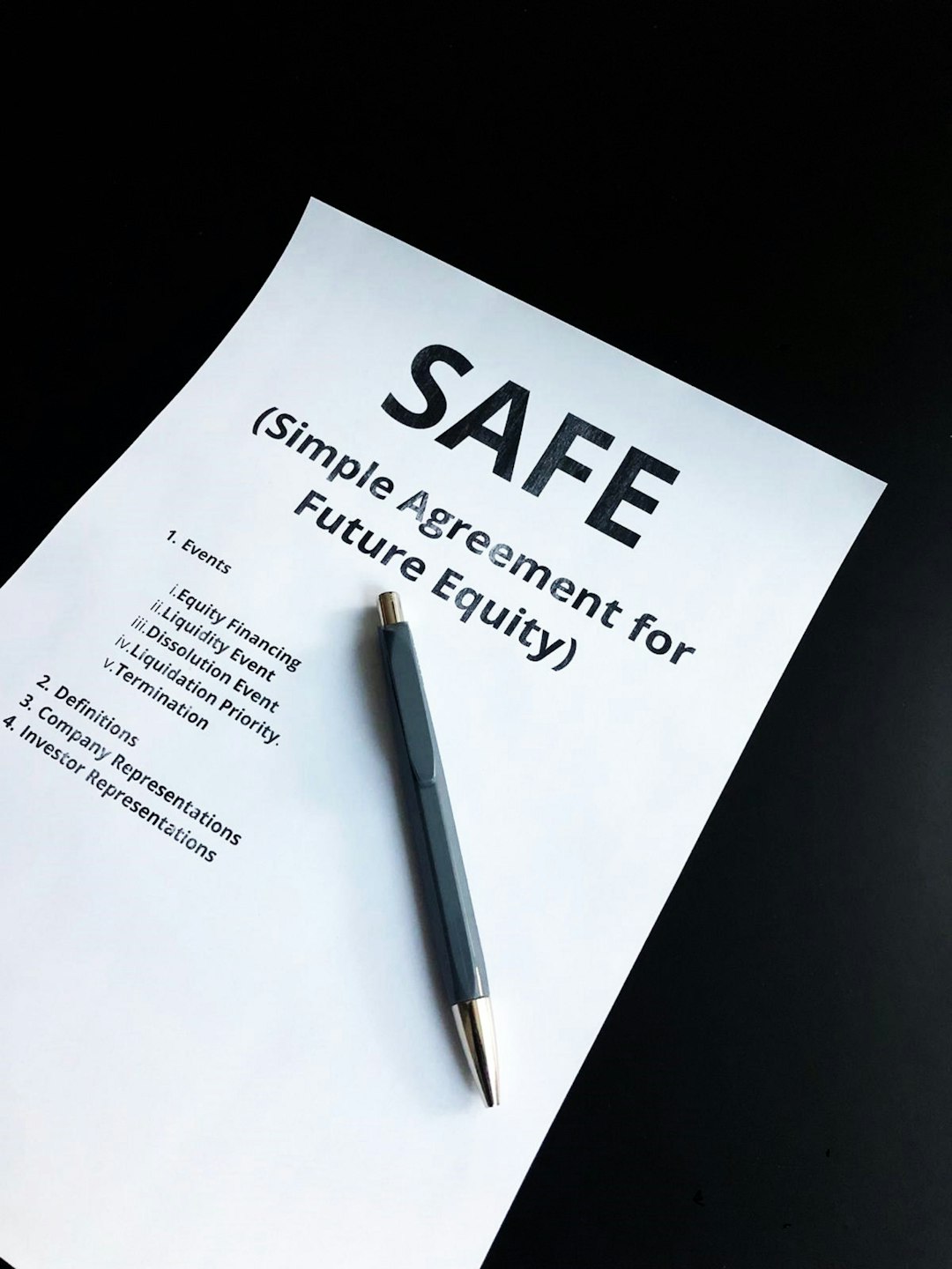 a pen sitting on top of a piece of paper risk register audit controls regulatory compliance