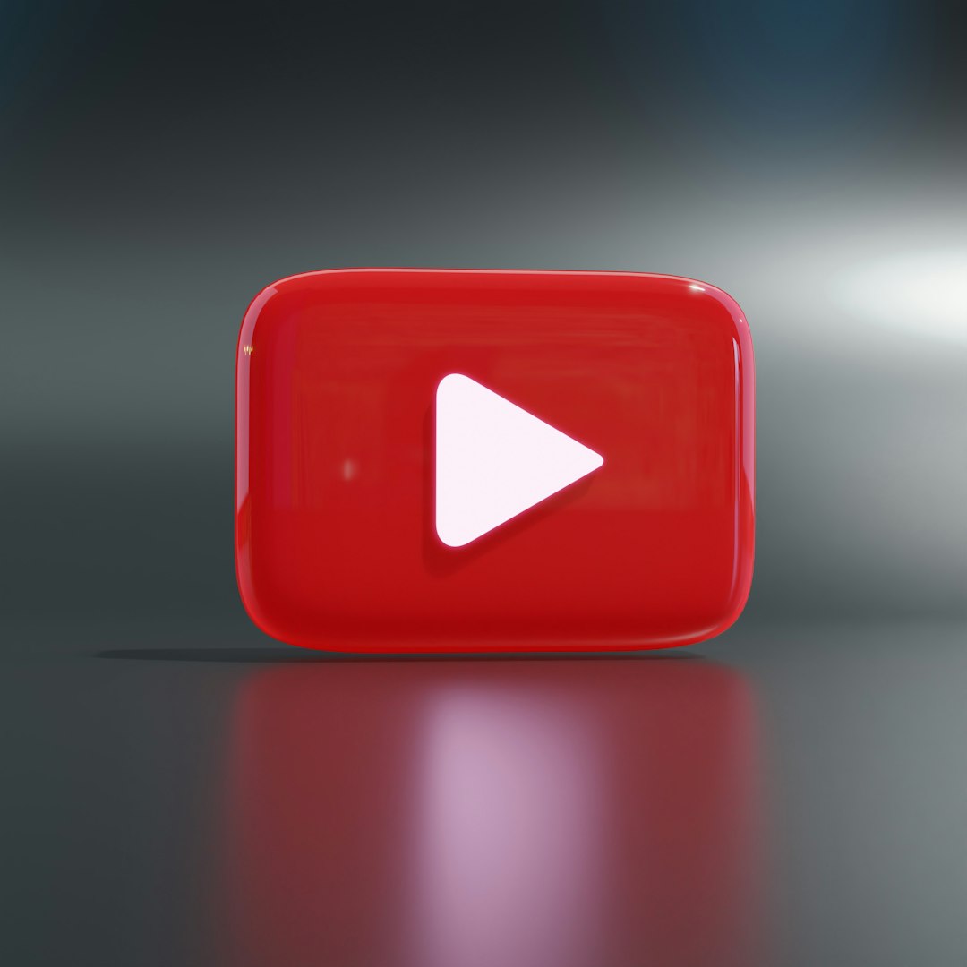 a red play button sitting on top of a table youtube upload workflow compression settings file comparison