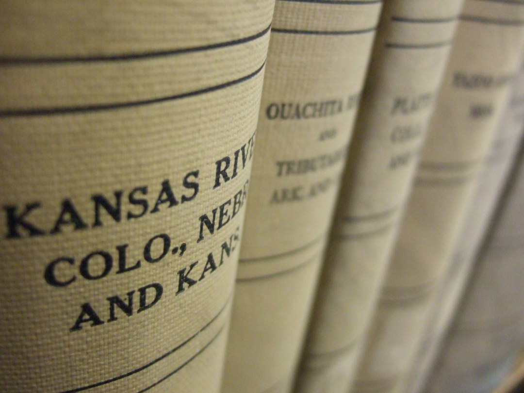 a row of books sitting next to each other retirement planning kansas map legal checklist 1