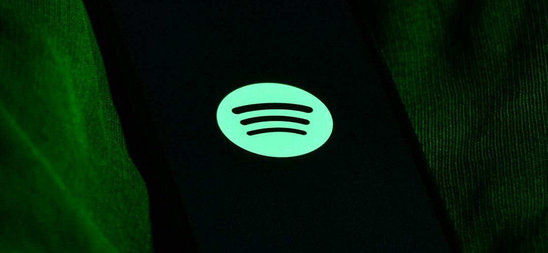 black and white power bank spotify app phone offline playlist green download icon