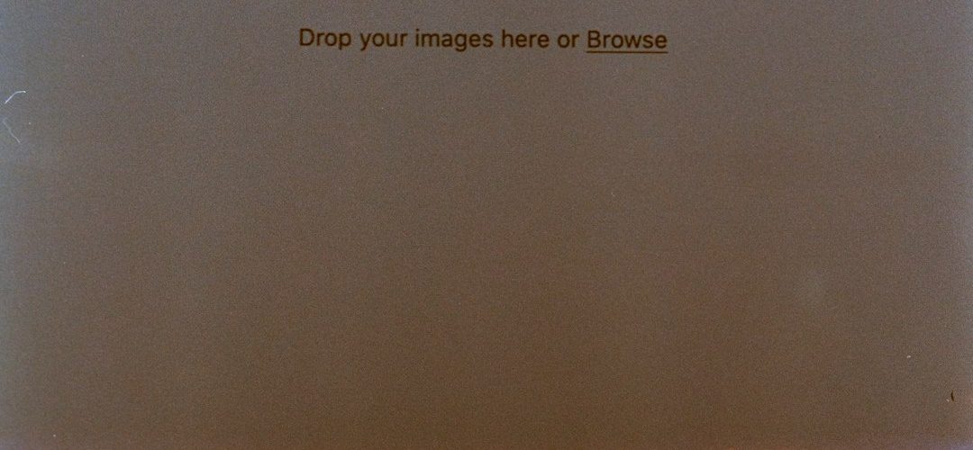 black laptop computer on brown wooden table image converter comparison upload screen jpg files
