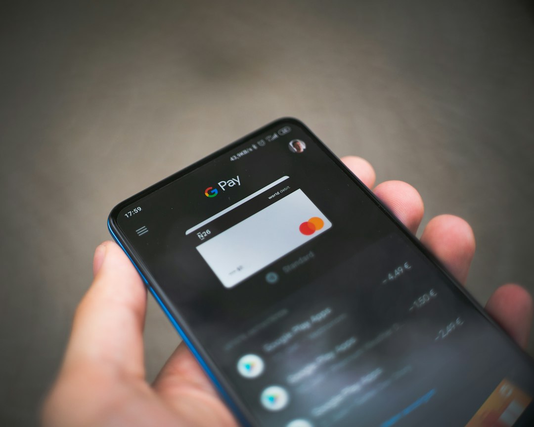 black samsung android smartphone displaying icons mobile banking app checking account quick transfer