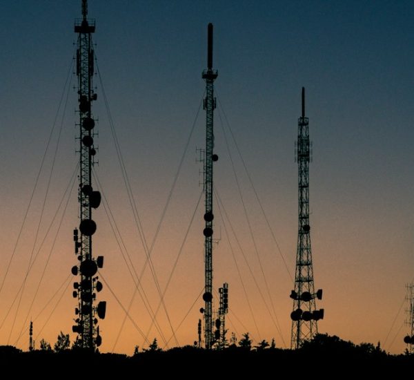 Does T-Mobile Use Verizon Towers? Network Infrastructure Explained 6 black towers during sunset cell tower antennas city
