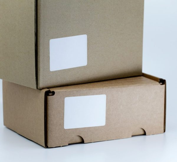 OpenCart Third-Party Logistics Services Compared: ShipStation vs Packlink PRO vs Sendcloud for Ecommerce Fulfillment 8 brown cardboard box on white table shipping dashboard parcels ecommerce orders
