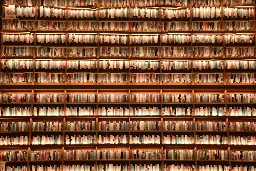 rows of books on shelves in a library vinyl records archive shelves vintage audio headphones