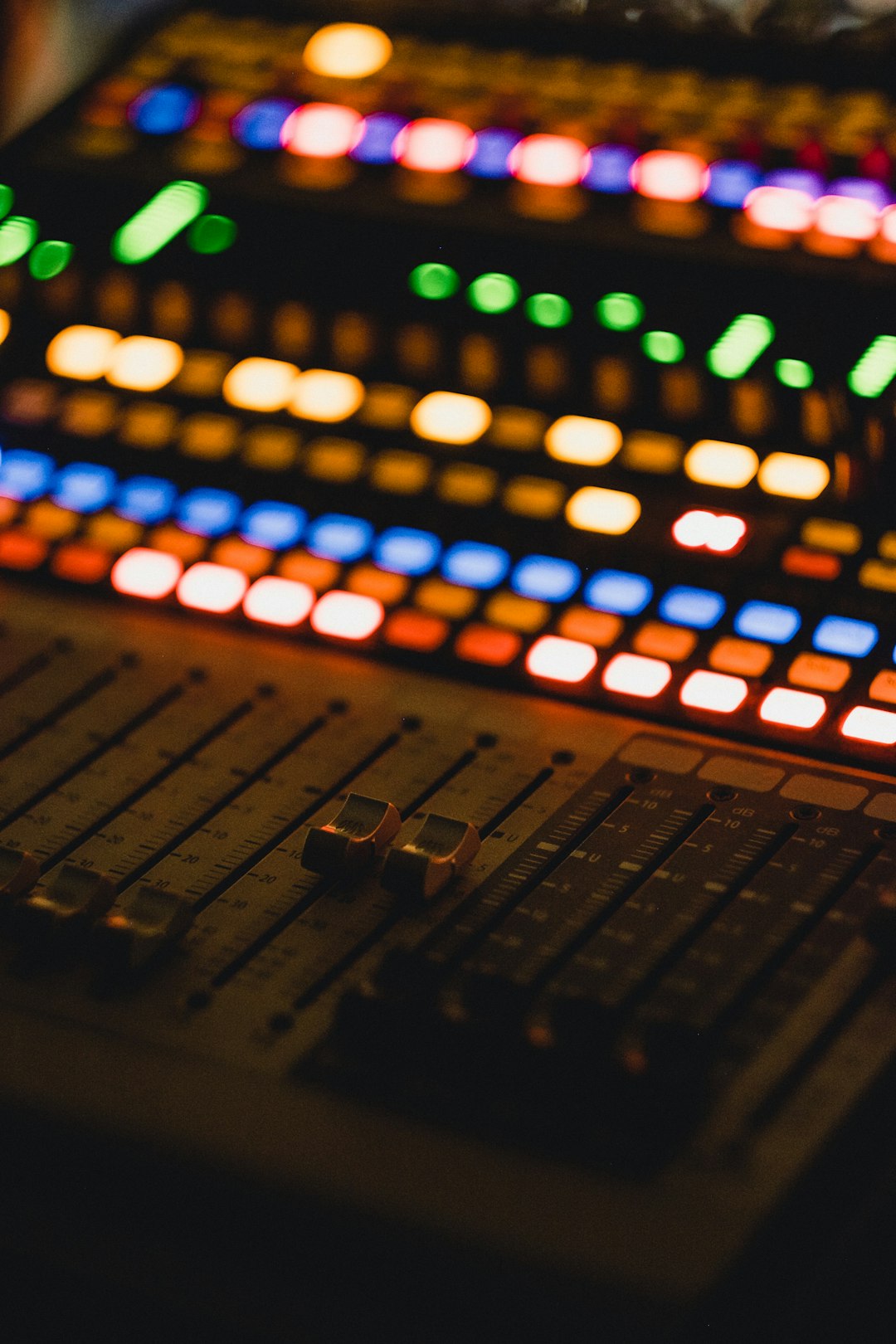 shallow focus photography of audio mixer music workflow audio editing creator desk sound waves