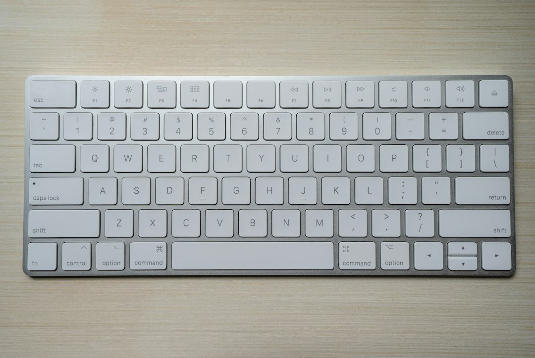 silver and white computer keyboard mac keyboard option key section sign