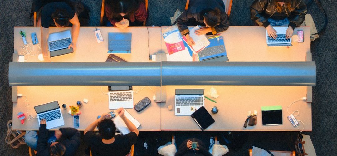students studying together at a long table security team meeting ransomware alert incident timeline