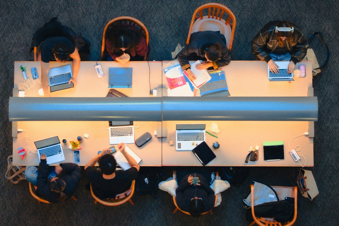 students studying together at a long table security team meeting ransomware alert incident timeline