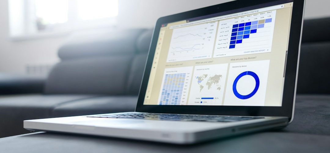 turned on black and grey laptop computer b2b ecommerce dashboard buyer portal order data