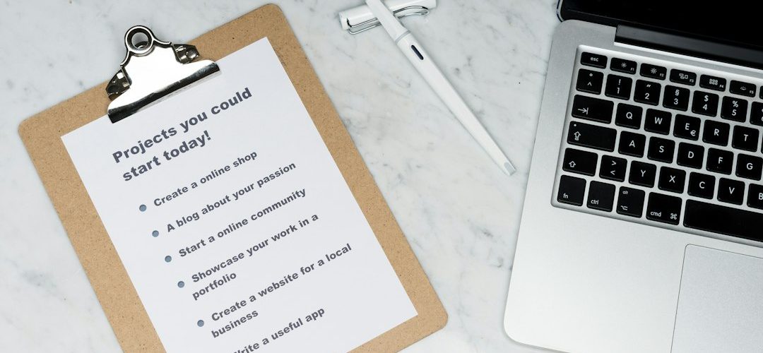 white printer paper beside silver laptop computer email checklist professional farewell workplace etiquette