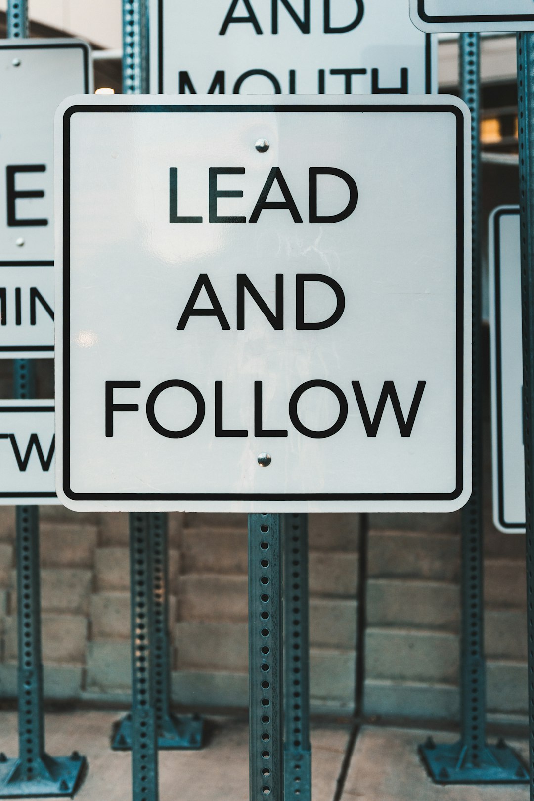 white sign with black text lead and follow lead follow up sales alerts customer journey